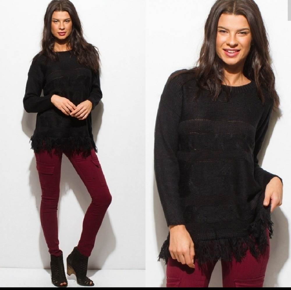 Fringed cable knit sweater
